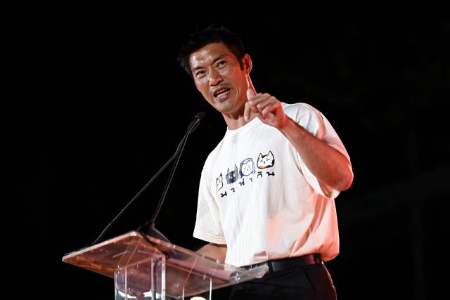 People’s Party campaign assistant and former leader of the Future Forward Party Thanathorn Juangroongruangkit speaks at a People’s Party rally ahead of the general election, in Bangkok on January 25, 2026. (Photo by Lillian SUWANRUMPHA / AFP)