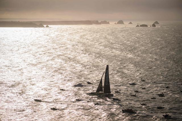 TOPSHOT - French skipper Thomas Coville and his crew members sail aboard the Ultim class multihull "Sodebo Ultim 3" after crossing the finish line at the end of their Jules Verne Trophy attempt, in the Atlantic Ocean, off the coast of Brest, Brittany, western France, on January 25, 2026. The Jules Verne Trophy is a prize for the fastest crewed, unassisted and non-stop circumnavigation of the world on any type of yacht. (Photo by Loic VENANCE / AFP)