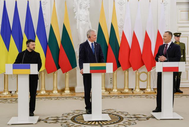 Ukraine's President Volodymyr Zelensky, Lithuania's President Gitanas Nauseda and Poland's President Karol Nawrocki hold a joint press conference after attending commemorations of the 1863 uprising, in Vilnius on January 25, 2026. (Photo by Petras Malukas / AFP)