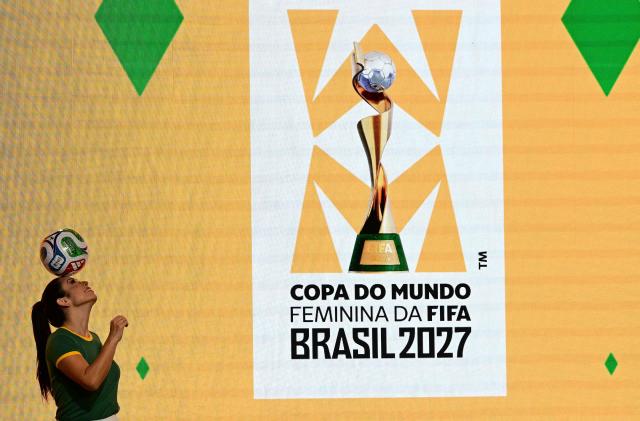 Artists perform in front of the 2027 FIFA Women's World Cup logo presented during the launch ceremony in Rio de Janeiro, Brazil on January 25, 2026. (Photo by Pablo PORCIUNCULA / AFP)