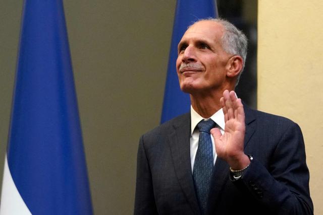 Honduran President-elect Nasry Asfura gestures during the inauguration of the National Mayor's Office of the Central District, at the National Museum in Tegucigalpa on January 25, 2026. Earliert this month Honduras electoral authorities rejected an order by the outgoing president to recount November's election won by Trump-backed candidate Nasry Asfura, a conservative businessman who was declared the winner of Honduras's presidential election on December 24, weeks after a tight race marred by delays and allegations of fraud. (Photo by Johny MAGALLANES / AFP)