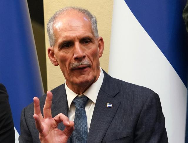 Honduran President-elect Nasry Asfura gestures during the inauguration of the National Mayor's Office of the Central District, at the National Museum in Tegucigalpa on January 25, 2026. Earliert this month Honduras electoral authorities rejected an order by the outgoing president to recount November's election won by Trump-backed candidate Nasry Asfura, a conservative businessman who was declared the winner of Honduras's presidential election on December 24, weeks after a tight race marred by delays and allegations of fraud. (Photo by Johny Magallanes / AFP)