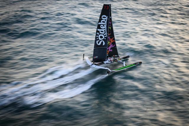 French skipper Thomas Coville and his crew members sail the Atlantic Ocean on the Ultim class multihull "Sodebo Ultim 3" after crossing the finish line of their successful attempt of breaking the Jules Verne Trophy record in 40 days 10 hours and 45 minutes, off the coast of Brest, Brittany, on January 25, 2026. The Jules Verne Trophy is a prize for the fastest crewed, unassisted and non-stop circumnavigation of the world on any type of yacht. (Photo by Loic VENANCE / AFP)