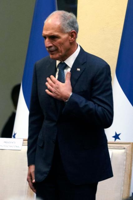 Honduran President-elect Nasry Asfura gestures during the inauguration of the National Mayor's Office of the Central District, at the National Museum in Tegucigalpa on January 25, 2026. Earliert this month Honduras electoral authorities rejected an order by the outgoing president to recount November's election won by Trump-backed candidate Nasry Asfura, a conservative businessman who was declared the winner of Honduras's presidential election on December 24, weeks after a tight race marred by delays and allegations of fraud. (Photo by Johny MAGALLANES / AFP)