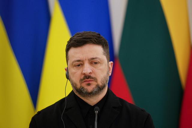Ukraine's President Volodymyr Zelensky looks on during a joint press conference with Lithuania's President and Poland's President, after attending commemorations of the 1863 uprising, in Vilnius on January 25, 2026. (Photo by Petras Malukas / AFP)