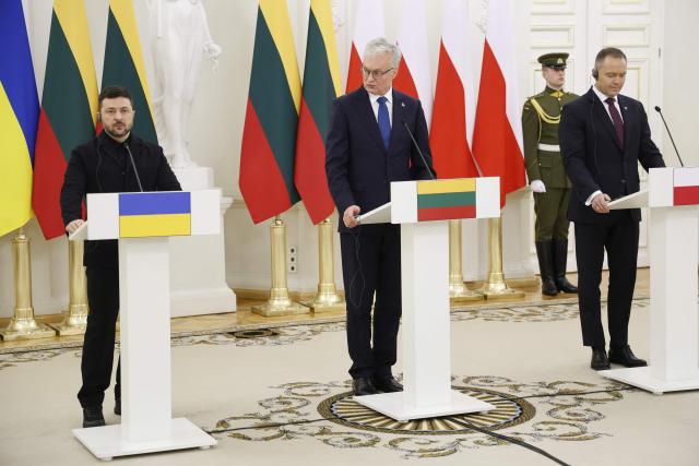 Ukraine's President Volodymyr Zelensky, Lithuania's President Gitanas Nauseda and Poland's President Karol Nawrocki hold a joint press conference after attending commemorations of the 1863 uprising, in Vilnius on January 25, 2026. (Photo by Petras Malukas / AFP)