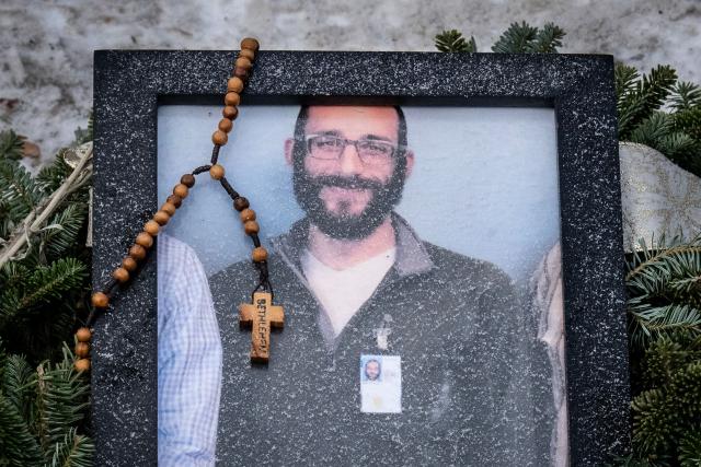TOPSHOT - A rosary adorns a framed photo Alex Pretti that was left at a makeshift memorial in the area where Pretti was shot dead a day earlier by federal immigration agents in Minneapolis, Minnesota, on January 25, 2026. On January 24, federal agents shot dead US citizen Alex Pretti, a 37-year-old ICU nurse, while scuffling with him on an icy roadway, less than three weeks after an immigration officer shot and killed Renee Good, also 37, in her car.
His killing sparked new protests and impassioned demands by local leaders for the Trump administration to end its operation in the city. (Photo by ROBERTO SCHMIDT / AFP)