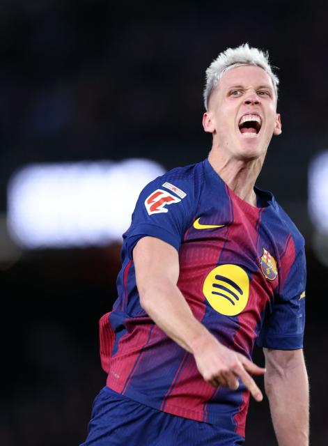 Barcelona's Spanish midfielder #20 Daniel Olmo celebrates scoring the opening goal during the Spanish league football match between FC Barcelona and Real Oviedo at Camp Nou Stadium in Barcelona on January 25, 2026. (Photo by Josep LAGO / AFP)