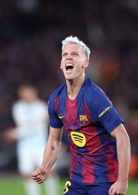 Barcelona's Spanish midfielder #20 Daniel Olmo celebrates scoring the opening goal during the Spanish league football match between FC Barcelona and Real Oviedo at Camp Nou Stadium in Barcelona on January 25, 2026. (Photo by Josep LAGO / AFP)