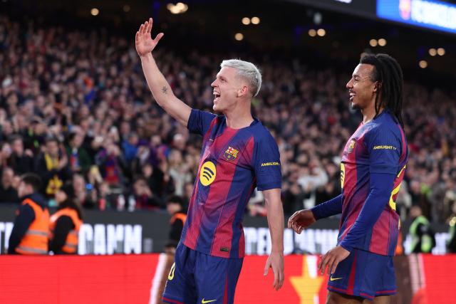 Barcelona's Spanish midfielder #20 Daniel Olmo (L) celebrates scoring the opening goal next to Barcelona's French defender #23 Jules Kounde during the Spanish league football match between FC Barcelona and Real Oviedo at Camp Nou Stadium in Barcelona on January 25, 2026. (Photo by Josep LAGO / AFP)