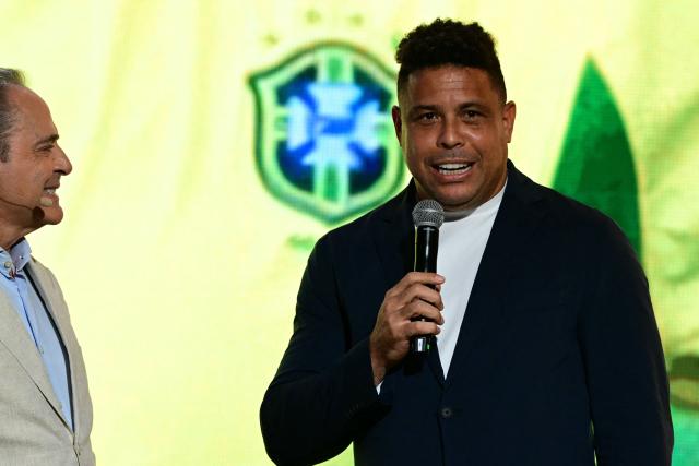 Brazil's former football star and world champion Ronaldo speaks next to Brazilian journalist and TV host Luis Roberto during the 2027 FIFA Women's World Cup launch ceremony in Rio de Janeiro, Brazil on January 25, 2026. (Photo by Pablo PORCIUNCULA / AFP)