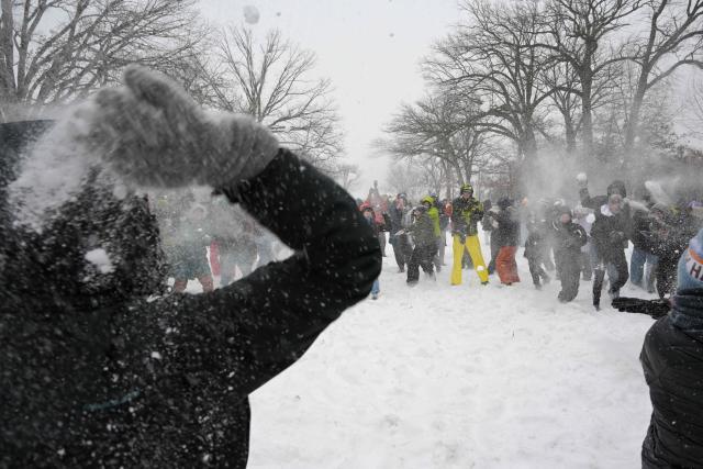 People participate in a snowball fight in Meridian Hill Park in Washington, DC, on January 25, 2026. A massive winter storm on January 24 dumped snow and freezing rain from New Mexico to North Carolina as it swept across the United States towards the northeast, threatening tens of millions of Americans with blackouts, transportation chaos and bone-chilling cold. After battering the country's southwest and central areas, the storm system began to hit the heavily populated mid-Atlantic and northeastern states as a frigid air mass settled in across the nation. (Photo by Oliver Contreras / AFP)