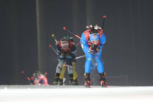Italy's Lisa Vittozzi (R) competes in the women's 12.5 km mass start competition of the IBU Biathlon World Cup in Nove Mesto, Czech Republic, on January 25, 2026. (Photo by Radek MICA / AFP)