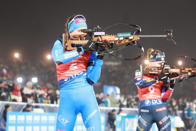 Italy's Lisa Vittozzi (L) and France's Oceane Michelon compete in the women's 12.5 km mass start competition of the IBU Biathlon World Cup in Nove Mesto, Czech Republic, on January 25, 2026. (Photo by Radek MICA / AFP)