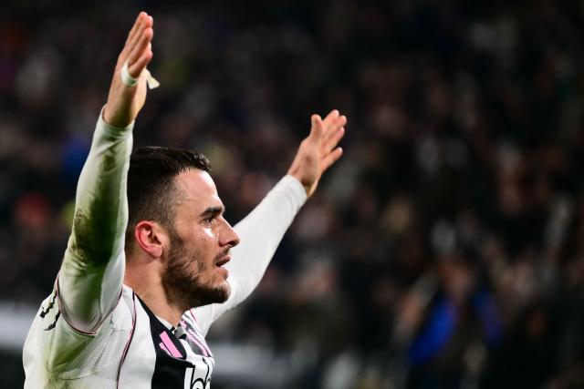 Juventus' Serbian midfielder #18 Filip Kostic celebrates after scoring a goal during the Italian Serie A football match between Juventus and Napoli at the Allianz Stadium in Turin on January 25, 2026. (Photo by MARCO BERTORELLO / AFP)