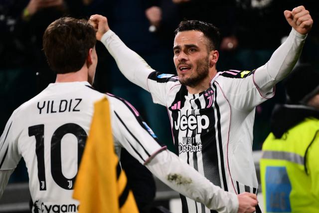 Juventus' Serbian midfielder #18 Filip Kostic (R) celebrates with Juventus' Turkish forward #10 Kenan Yildiz (L) after scoring a goal during the Italian Serie A football match between Juventus and Napoli at the Allianz Stadium in Turin on January 25, 2026. (Photo by MARCO BERTORELLO / AFP)