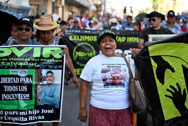 Salvadoran activists shout slogans demanding the release of their beloved ones during a protest against President Nayib Bukele's policies -including the state of emergency, within the anti-gang crackdown, in force since March 2022 and which allows arrests without a warrant- in San Salvador, on January 25, 2026. (Photo by Marvin RECINOS / AFP)