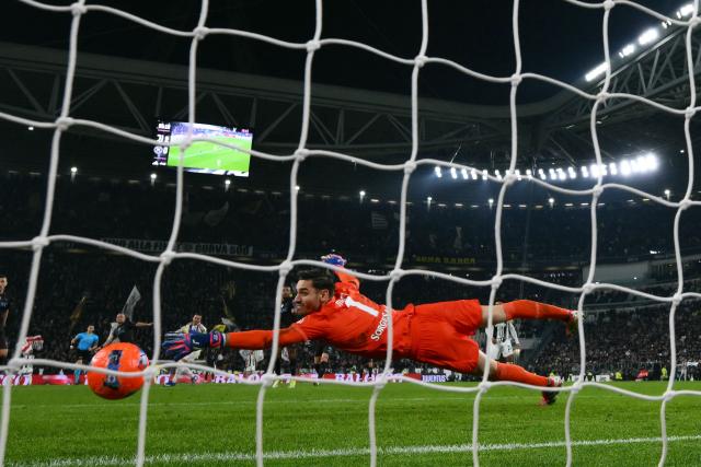 Napoli's Italian goalkeeper #01 Alex Meret fails to stop Juventus Serbian forward #18 Filip Kostic's shot on goal during the Italian Serie A football match between Juventus and Napoli at the Allianz Stadium in Turin on January 25, 2026. (Photo by MARCO BERTORELLO / AFP)