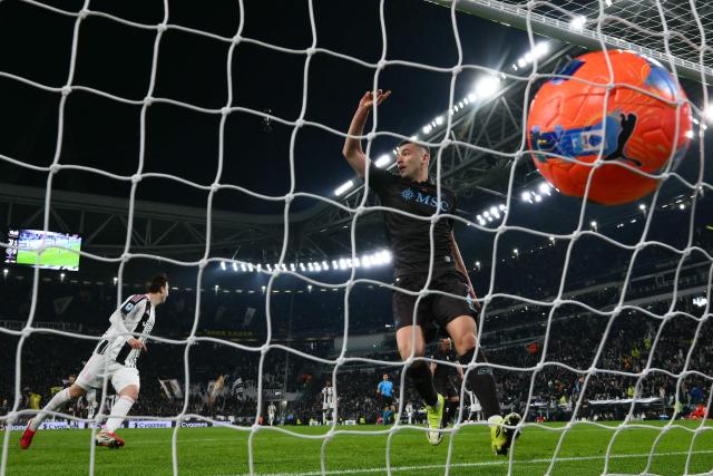 Napoli's Italian defender #04 Alessandro Buongiorno (R) reacts after Juventus' Turkish forward #10 Kenan Yildiz scores a goal during the Italian Serie A football match between Juventus and Napoli at the Allianz Stadium in Turin on January 25, 2026. (Photo by MARCO BERTORELLO / AFP)