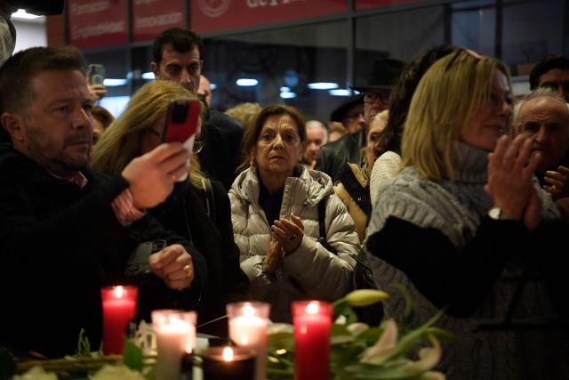 People attend a vigil in honour of the victims of the January 18 high-speed train accident that killed 45 people in Adamuz, on January 25, 2026 at the railway station of Huelva. One week after the train disaster involving two trains in southern Spain, which left 45 dead, remembrance ceremonies took place today in Huelva, where most of the victims came from, and in the town of Adamuz, where the collision occurred. (Photo by CRISTINA QUICLER / AFP)