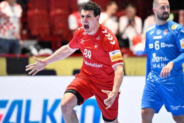 Switzerland's wing #29 Samuel Zehnder celebrates during the men's EHF Euro 2026 main round handball match Switzerland v Croatia in Malmo, Sweden, on January 25, 2026. (Photo by Johan Nilsson/TT / TT NEWS AGENCY / AFP) / Sweden OUT