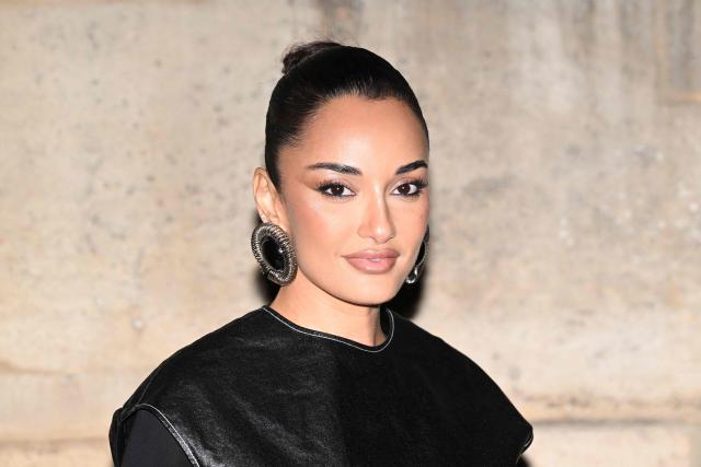 Jordanian-Romanian fashion designer  Amina Muaddi  poses for a photocall upon arrival to attend the Jacquemus Menswear ready-to-wear Fall-Winter 2026/2027 collection as part of the Men Paris Fashion Week in Paris on January 25, 2026. (Photo by Blanca CRUZ / AFP)