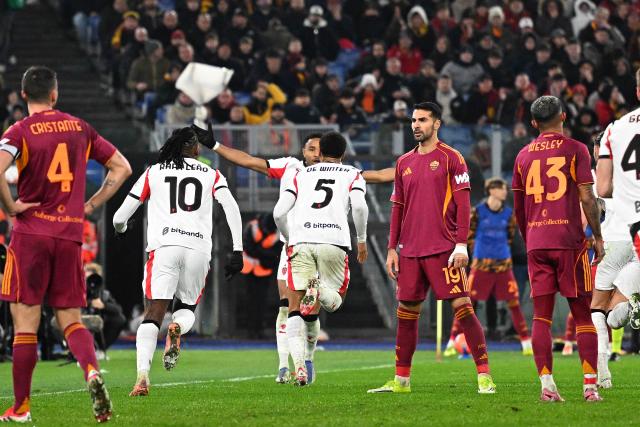 AC Milan's Belgian defender #05 Koni De Winter (C) celebrates after scoring a goal during the Italian Serie A football match between AS Roma and Milan at the Olympic Stadium in Rome on January 25, 2026. (Photo by Andreas SOLARO / AFP)