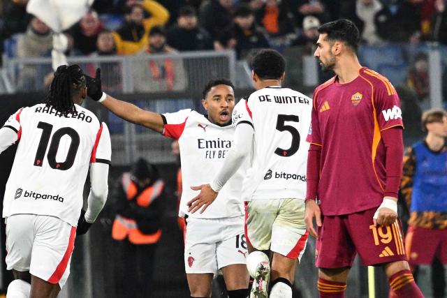 AC Milan's Belgian defender #05 Koni De Winter (C) celebrates after scoring a goal during the Italian Serie A football match between AS Roma and Milan at the Olympic Stadium in Rome on January 25, 2026. (Photo by Andreas SOLARO / AFP)
