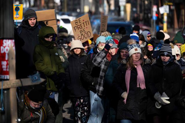 Protesters against Immigration and Customs Enforcement (ICE) march through the streets of downtown Minneapolis, Minnesota, on January 25, 2026. On January 24, federal agents shot dead US citizen Alex Pretti, a 37-year-old ICU nurse, while scuffling with him on an icy roadway, less than three weeks after an immigration officer shot and killed Renee Good, also 37, in her car. His killing sparked new protests and impassioned demands by local leaders for the Trump administration to end its operation in the city. (Photo by ROBERTO SCHMIDT / AFP)