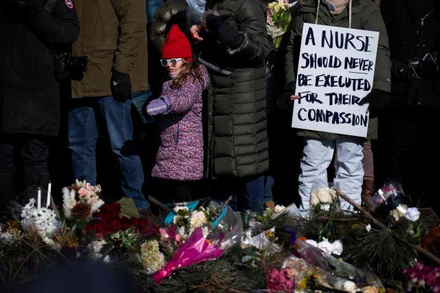 Protesters against Immigration and Customs Enforcement (ICE) march through the streets of downtown Minneapolis, Minnesota, on January 25, 2026. On January 24, federal agents shot dead US citizen Alex Pretti, a 37-year-old ICU nurse, while scuffling with him on an icy roadway, less than three weeks after an immigration officer shot and killed Renee Good, also 37, in her car. His killing sparked new protests and impassioned demands by local leaders for the Trump administration to end its operation in the city. (Photo by ROBERTO SCHMIDT / AFP)