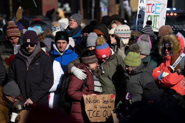Protesters against Immigration and Customs Enforcement (ICE) march through the streets of downtown Minneapolis, Minnesota, on January 25, 2026. On January 24, federal agents shot dead US citizen Alex Pretti, a 37-year-old ICU nurse, while scuffling with him on an icy roadway, less than three weeks after an immigration officer shot and killed Renee Good, also 37, in her car. His killing sparked new protests and impassioned demands by local leaders for the Trump administration to end its operation in the city. (Photo by ROBERTO SCHMIDT / AFP)