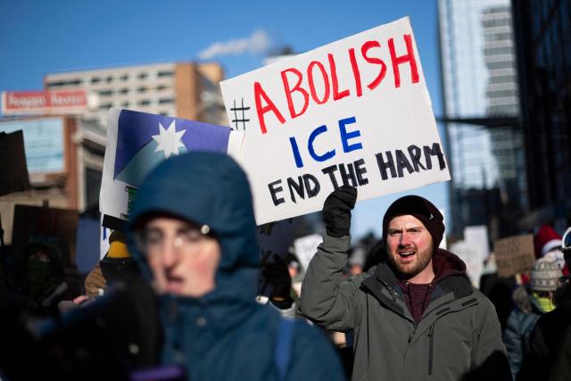 Protesters against Immigration and Customs Enforcement (ICE) march through the streets of downtown Minneapolis, Minnesota, on January 25, 2026. On January 24, federal agents shot dead US citizen Alex Pretti, a 37-year-old ICU nurse, while scuffling with him on an icy roadway, less than three weeks after an immigration officer shot and killed Renee Good, also 37, in her car. His killing sparked new protests and impassioned demands by local leaders for the Trump administration to end its operation in the city. (Photo by ROBERTO SCHMIDT / AFP)