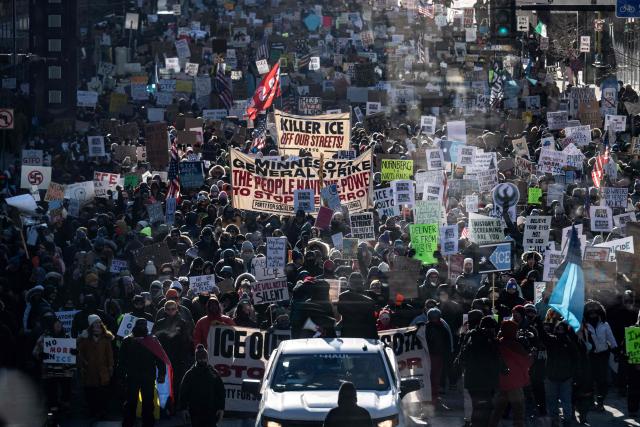 Protesters against Immigration and Customs Enforcement (ICE) march through the streets of downtown Minneapolis, Minnesota, on January 25, 2026. On January 24, federal agents shot dead US citizen Alex Pretti, a 37-year-old ICU nurse, while scuffling with him on an icy roadway, less than three weeks after an immigration officer shot and killed Renee Good, also 37, in her car. His killing sparked new protests and impassioned demands by local leaders for the Trump administration to end its operation in the city. (Photo by ROBERTO SCHMIDT / AFP)