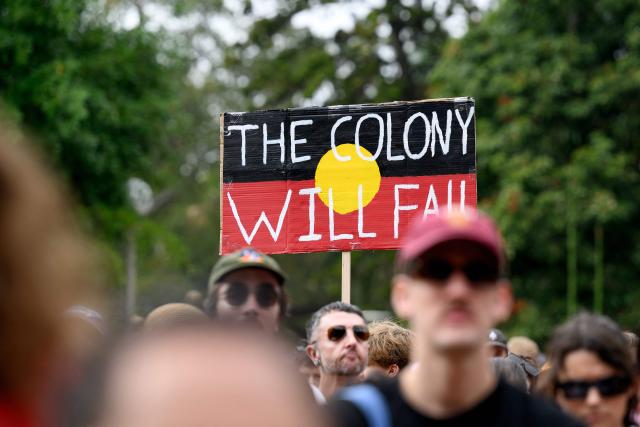 Protesters take part in the annual "Invasion Day" rally, organised on Australia Day, in Sydney on January 26, 2026. (Photo by Steven Markham / AFP)