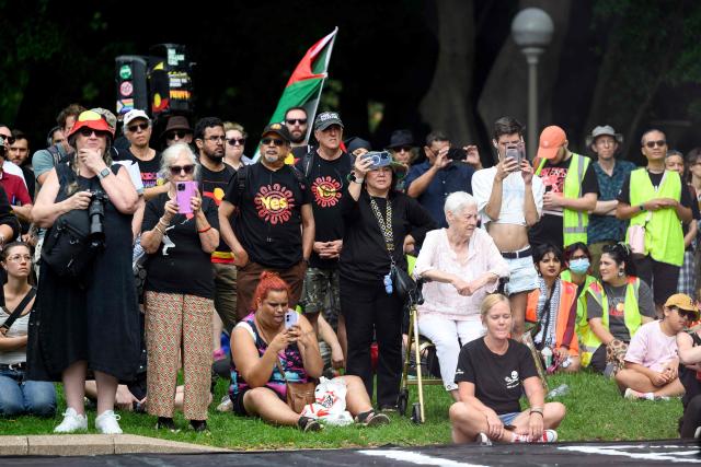 Protesters take part in the annual "Invasion Day" rally, organised on Australia Day, in Sydney on January 26, 2026. (Photo by Steven Markham / AFP)