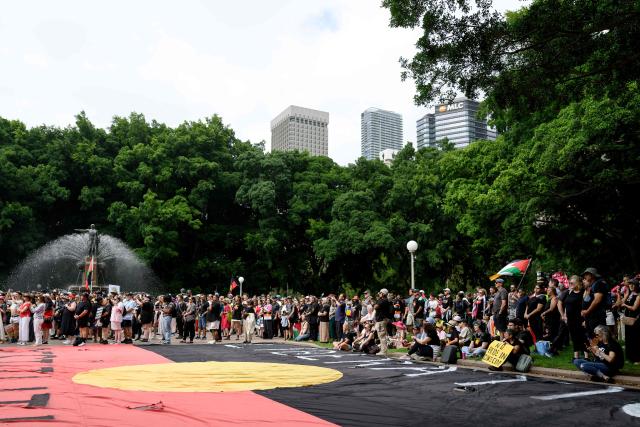 Protesters take part in the annual "Invasion Day" rally, organised on Australia Day, in Sydney on January 26, 2026. (Photo by Steven Markham / AFP)