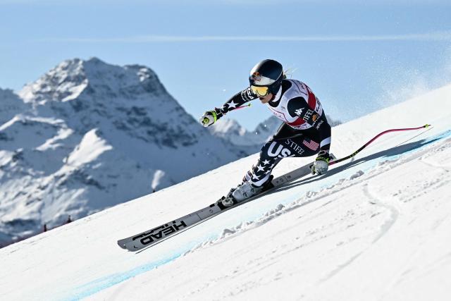 (FILES) US Lindsey Vonn competes in the women's downhill race part of the FIS Alpine Ski World Cup 2025-2026, in St Moritz, south-eastern Switzerland on December 12, 2025. US ski star Lindsey Vonn has defied age and injury to make one of the most remarkable comebacks in Olympic history, the latest chapter in a storied career of memorable highs and crushing setbacks. Vonn will be 41 when she takes to the slope of Cortina d'Ampezzo next month for her fifth Olympics. She retired after the 2019 world championships in Are but made what she dubbed a "crazy" comeback last winter. (Photo by Fabrice COFFRINI / AFP)