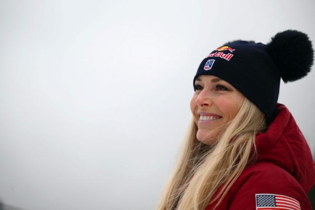(FILES) US' Lindsey Vonn, second, smiles after the podium ceremony of the Women's Super G event of FIS Alpine Skiing World Cup in Tarvisio, Italy on January 18, 2026. US ski star Lindsey Vonn has defied age and injury to make one of the most remarkable comebacks in Olympic history, the latest chapter in a storied career of memorable highs and crushing setbacks. Vonn will be 41 when she takes to the slope of Cortina d'Ampezzo next month for her fifth Olympics. She retired after the 2019 world championships in Are but made what she dubbed a "crazy" comeback last winter. (Photo by Marco BERTORELLO / AFP)
