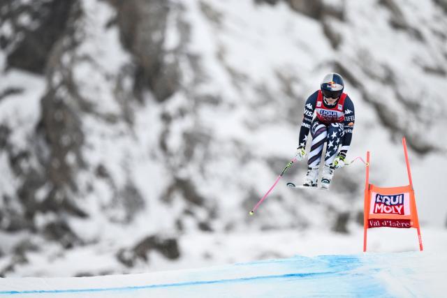 (FILES) US Lindsey Vonn competes in the women's downhill race part of the FIS Alpine Ski World Cup 2025-2026, in Val d'Isere, south western France, on December 20, 2025. US ski star Lindsey Vonn has defied age and injury to make one of the most remarkable comebacks in Olympic history, the latest chapter in a storied career of memorable highs and crushing setbacks. Vonn will be 41 when she takes to the slope of Cortina d'Ampezzo next month for her fifth Olympics. She retired after the 2019 world championships in Are but made what she dubbed a "crazy" comeback last winter. (Photo by Jeff PACHOUD / AFP)