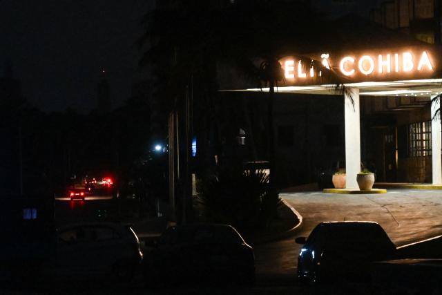 The Melia Cohiba Hotel running with electricity is seen during a blackout in Havana on January 25, 2026. (Photo by YAMIL LAGE / AFP)