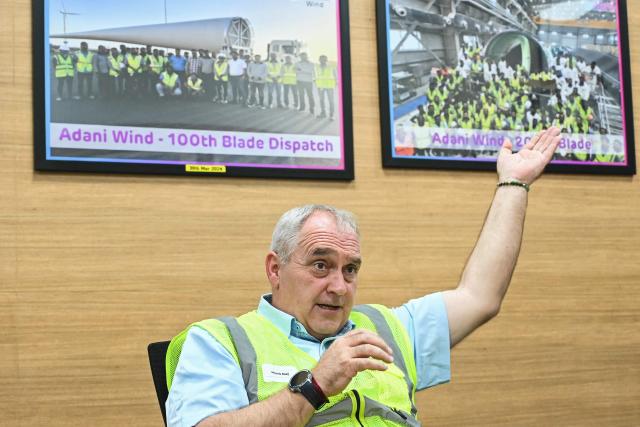 This photograph taken November 5, 2025 shows Hendrik Booij, vice president of the Adani Wind's blade and wind turbine generator (WTG) manufacturing plant in Mundra speaking during an interview with AFP at the facility in Mundra. The race for green energy is on. India, driven by soaring electricity demand and a push to reduce reliance on China, is rapidly producing solar panels, fuelling a booming yet uncertain market. (Photo by Shammi MEHRA / AFP) / TO GO WITH India-environment-politics-energy, FOCUS by Philippe Alfroy