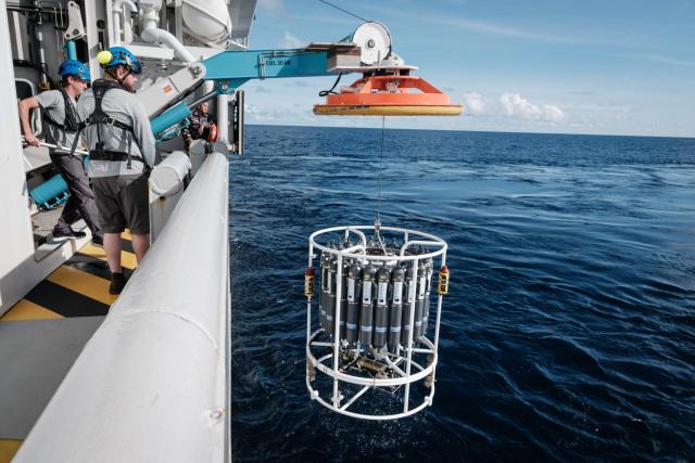 This photo taken on January 10, 2026 shows the recovery of a CTD (conductivity, temperature, depth) instrument on the OceanXplorer, a research vessel operated by the marine non-profit OceanX, in the waters off Sulawesi island. A dome-fronted submersible sinks beneath the waves off Indonesia, heading nearly 1,000 metres down to the realm of purple-frilled corals and bioluminescent shrimp. This month, AFP boarded one of two submersibles belonging to OceanX, a non-profit founded by billionaire Ray Dalio and his son that works with scientists on its OceanXplorer ship to study the marine world. (Photo by YASUYOSHI CHIBA / AFP) / To go with 'INDONESIA-OCEANX-OCEANS-ENVIRONMENT-RESEARCH-SCIENCE' by Sara HUSSEIN