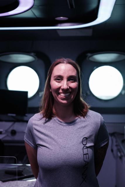 This photo taken on January 11, 2026, shows Larissa Fruehe, a German environmental DNA (eDNA) scientist, posing in her laboratory on the OceanXplorer, a research vessel operated by the marine non-profit OceanX, in waters off Sulawesi island. A dome-fronted submersible sinks beneath the waves off Indonesia, heading nearly 1,000 metres down to the realm of purple-frilled corals and bioluminescent shrimp. This month, AFP boarded one of two submersibles belonging to OceanX, a non-profit founded by billionaire Ray Dalio and his son that works with scientists on its OceanXplorer ship to study the marine world. (Photo by YASUYOSHI CHIBA / AFP) / To go with: INDONESIA-OCEANX-OCEANS-ENVIRONMENT-RESEARCH-SCIENCE, by Sara HUSSEIN
