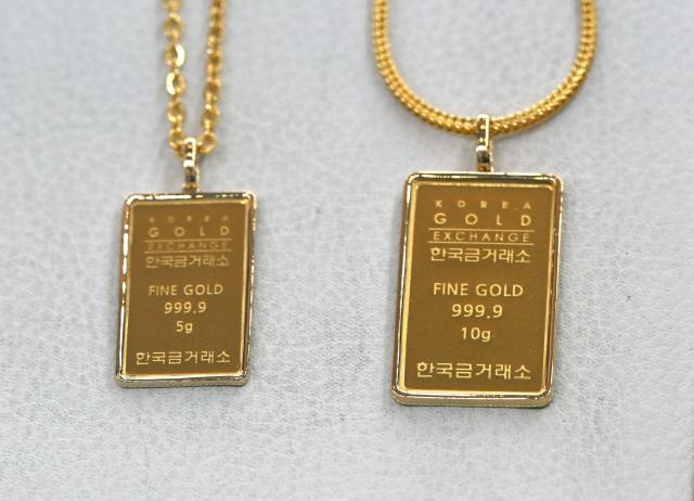 Gold jewelry is displayed at a store of the Korea Gold Exchange in Seoul on January 26, 2026. The price of safe-haven asset gold surpassed $5,000 on January 25, hitting a record amid rising global uncertainty and turmoil set off by US President Donald Trump's policies. (Photo by Jung Yeon-je / AFP)