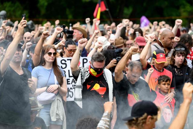 Protesters take part in the annual "Invasion Day" rally, organised on Australia Day, in Sydney on January 26, 2026. (Photo by Steven Markham / AFP)
