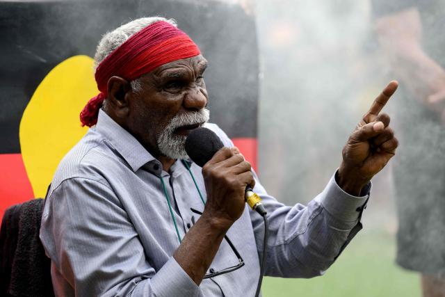 Warlpiri Elder Uncle Ned Hargraves sings during the annual "Invasion Day" rally, organised on Australia Day, in Sydney on January 26, 2026. (Photo by Steven Markham / AFP)