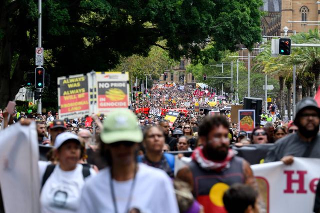 Protesters take part in the annual "Invasion Day" rally, organised on Australia Day, in Sydney on January 26, 2026. (Photo by Steven Markham / AFP)