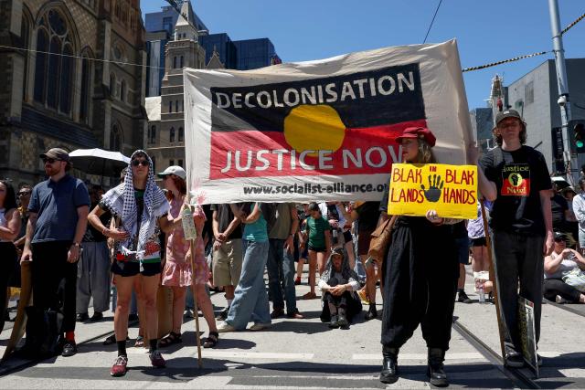 Demonstrators take part in the annual "Invasion Day" rally in Melbourne on Australia Day on January 26, 2026. (Photo by Izhar KHAN / AFP)