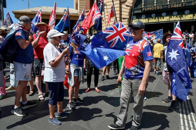 Anti-government protesters take part in a rally on Australia Day in Melbourne on January 26, 2026. (Photo by Izhar KHAN / AFP)