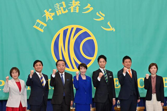 (L-R) Japanese Communist Party Chair Tomoko Tamura, Democratic Party for the People leader Yuichiro Tamaki, Centrist Reform Alliance co-leader Yoshihiko Noda, Liberal Democratic Party President and Prime Minister Sanae Takaichi, Japan Innovation Party co-leader Fumitake Fujita, Sanseito leader Sohei Kamiya, Reiwa Shinsengumi co-leader Akiko Oishi pose during a panel discussion at the Japan National Press Club (JNPC) in Tokyo on January 26, 2026. (Photo by David Mareuil / POOL / AFP)